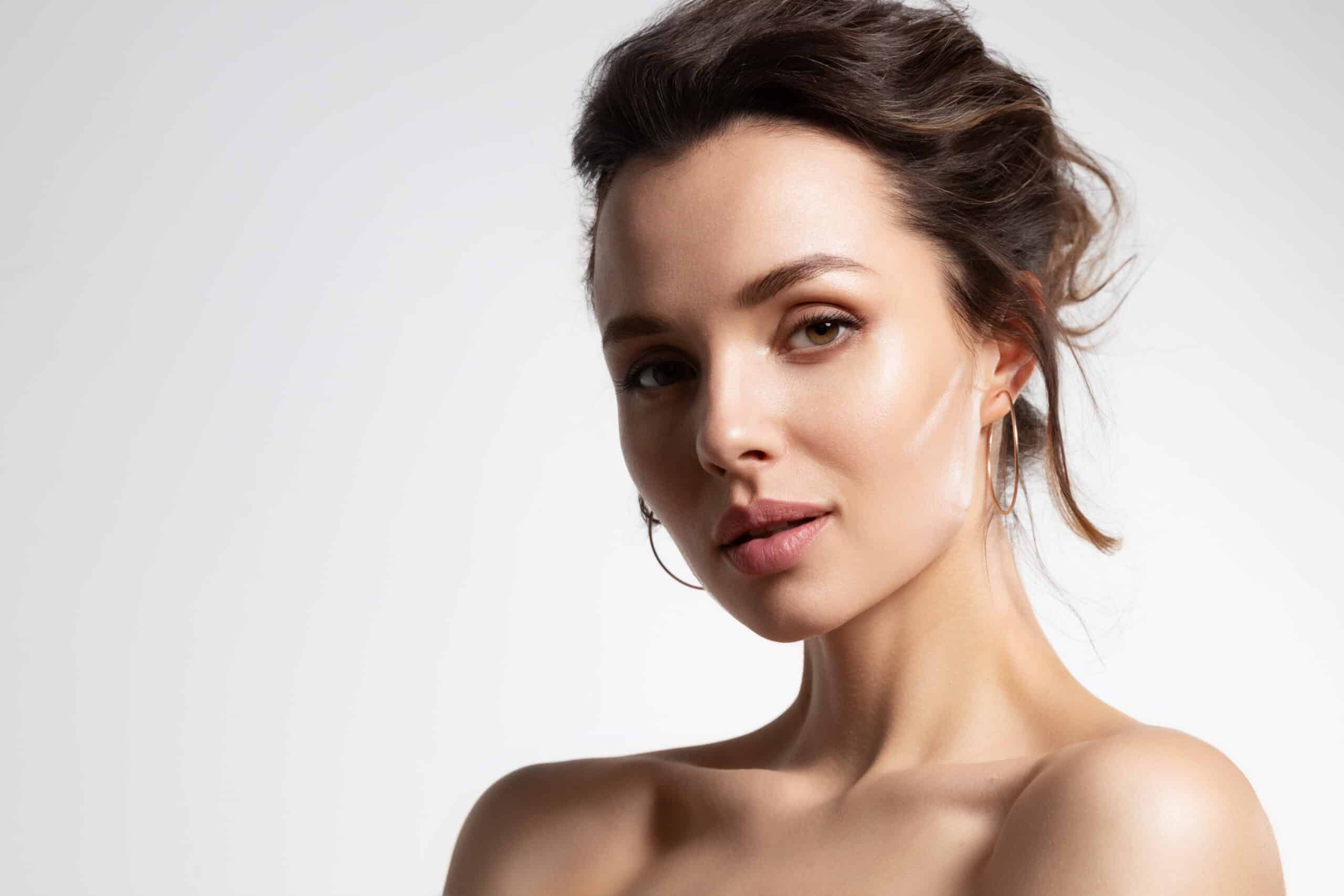 Young woman with perfect skin isolated on white background. Ad poster of skincare cosmetics and rejuvenation procedure